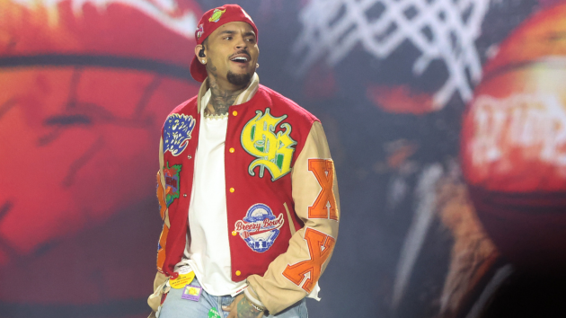 Chris Brown gives Usher his flowers onstage: ‘He’s the greatest’