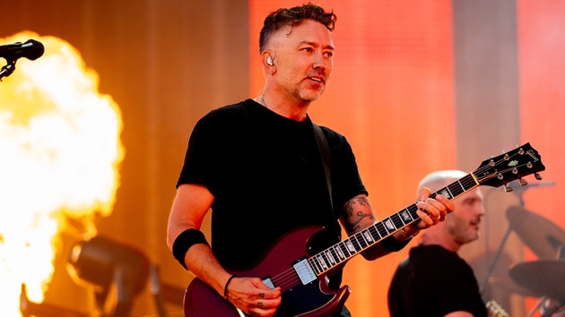 Watch Rise Against’s Tim McIlrath strum ‘Swing Life Away’ on historic guitar